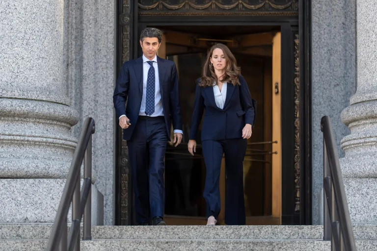 Josh Wander leaves a New York courthouse with a woman beside him